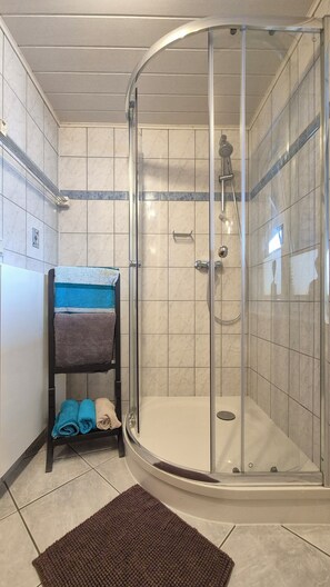 Shower, hair dryer, towels, soap