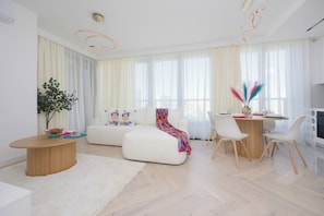 Apartment, 1 Bedroom, Balcony | Living area | 65-inch Smart TV with cable channels - Grzybowska Apartment by Renters Prestige (Warsaw)