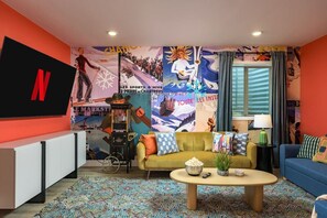 TV connectée, cheminée, jeux vidéo, livres