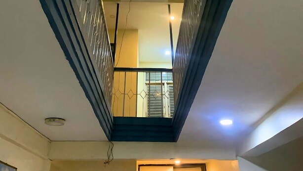 A view of a corridor with a skylight and a balcony. - Rightway Hotel & Restaurant (Kathmandu)