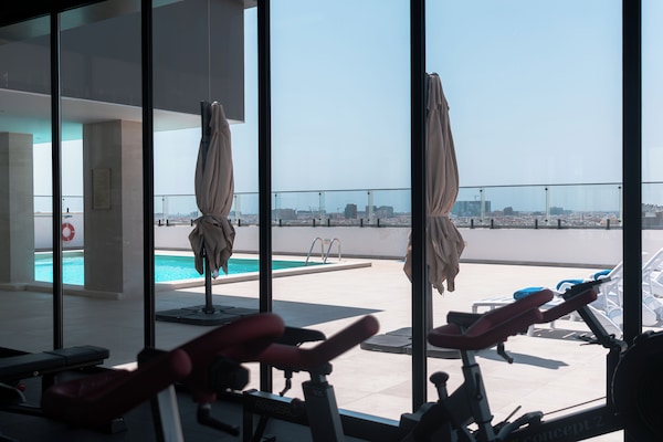 Outdoor pool, open 8:00 AM to 8:00 PM, pool umbrellas, pool loungers