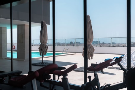 Outdoor pool, open 8:00 AM to 8:00 PM, pool umbrellas, sun loungers