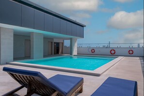 Outdoor pool, open 8:00 AM to 8:00 PM, pool umbrellas, sun loungers