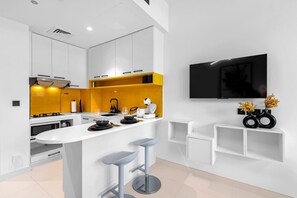 Fridge, microwave, oven, stovetop - Premium Studio Apartment at Loci Residences JVC (Dubai)