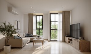 Chambre Double Supérieure | Coin séjour | TV connectée