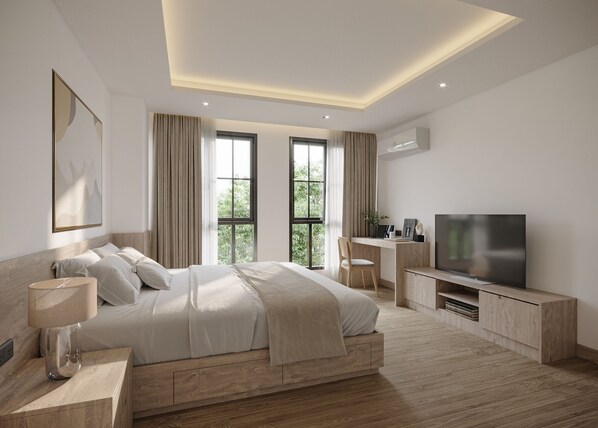 A modern bedroom with a large bed, a desk, and a TV. - Leon Lasalle Hotel & Residences (Bangkok)