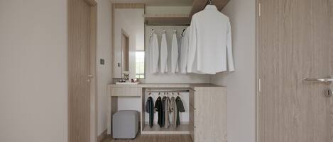 A modern bathroom with a wooden vanity, a hanging robe, and a mirror.