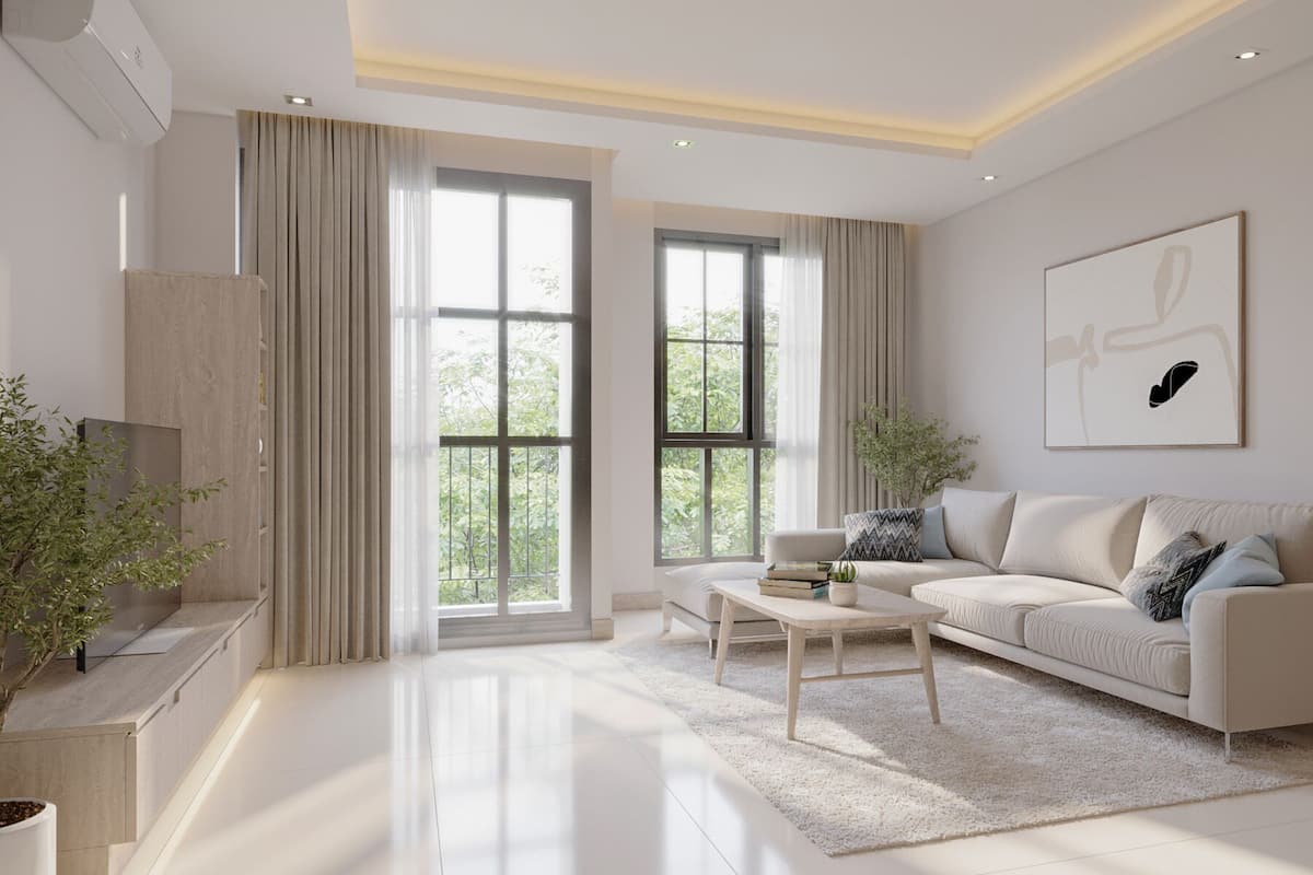 A modern living room with a white sofa, a coffee table, and a large window with curtains.