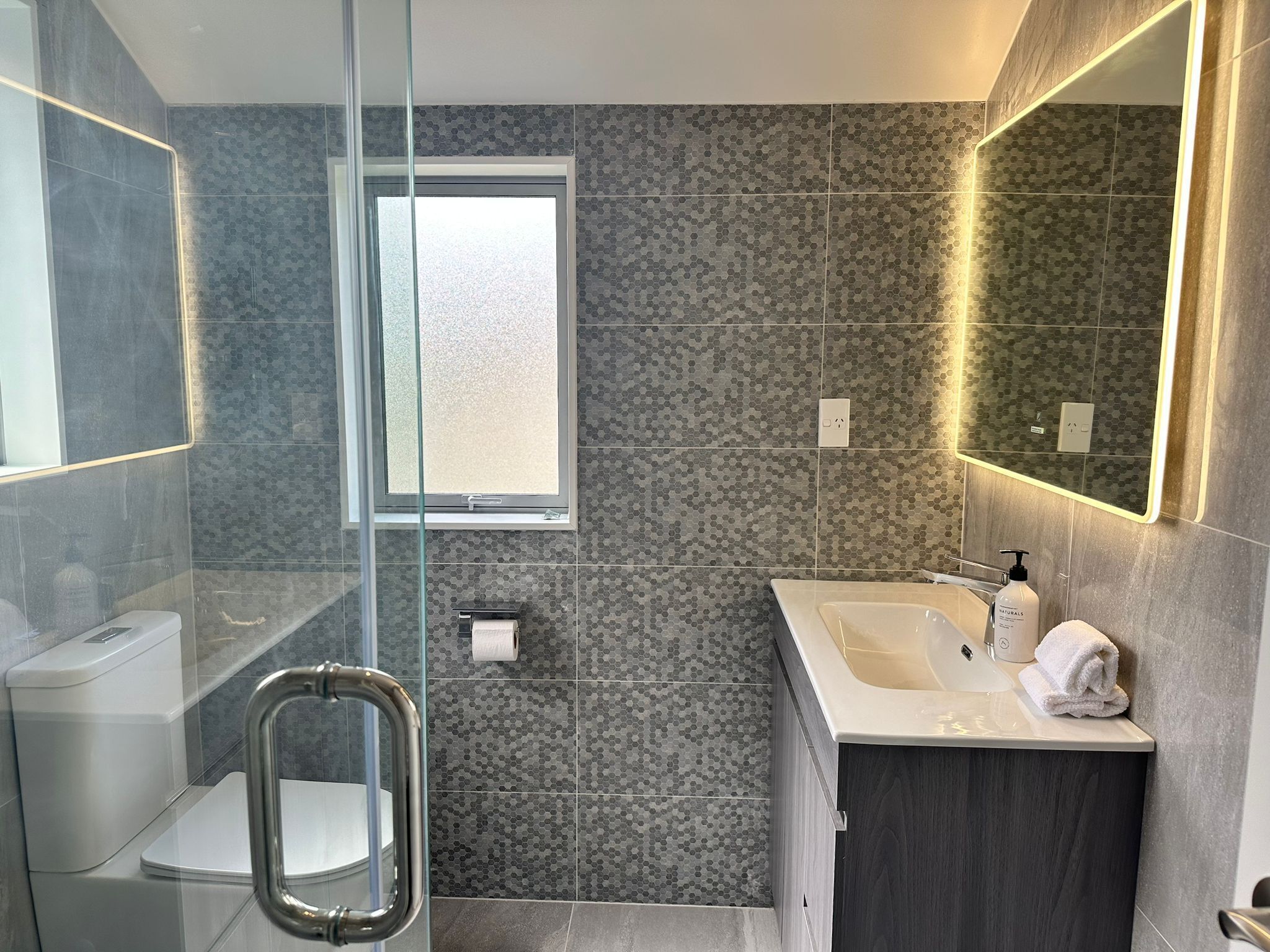 Shower, hair dryer, towels, soap