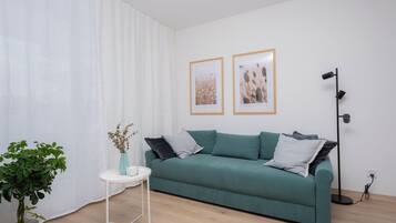 Comfort appartement | Woonkamer | Flatscreentelevisie