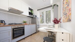 Apartment, 1 Bedroom, Balcony | Private kitchen | Coffee/tea maker, microwave, stovetop, dishwasher - Apartment in Saska Kępa by Renters (Warsaw)