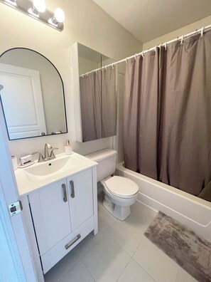 Hair dryer, towels, soap, shampoo
