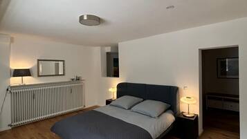 1 bedroom, desk, iron/ironing board, travel crib