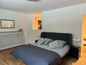 1 bedroom, desk, iron/ironing board, travel crib