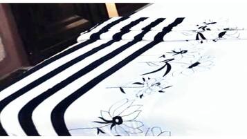 A striped floor with floral patterns.