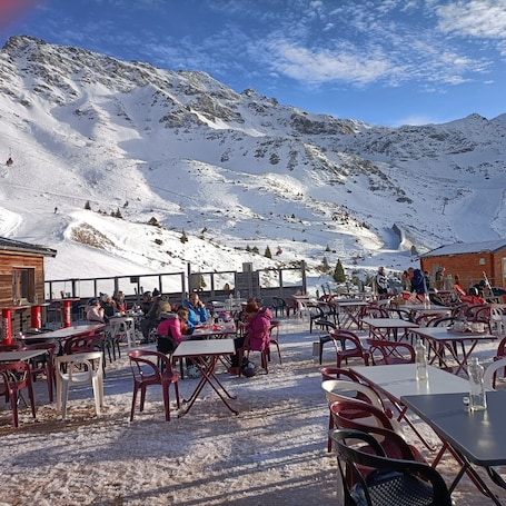 Outdoor dining. Apartment 'Studio Gaelle' with Mountain View, Shared Pool and Shared Garden