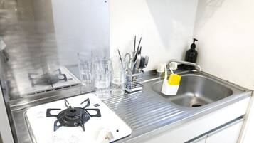 Fridge, microwave, stovetop, cookware/dishes/utensils