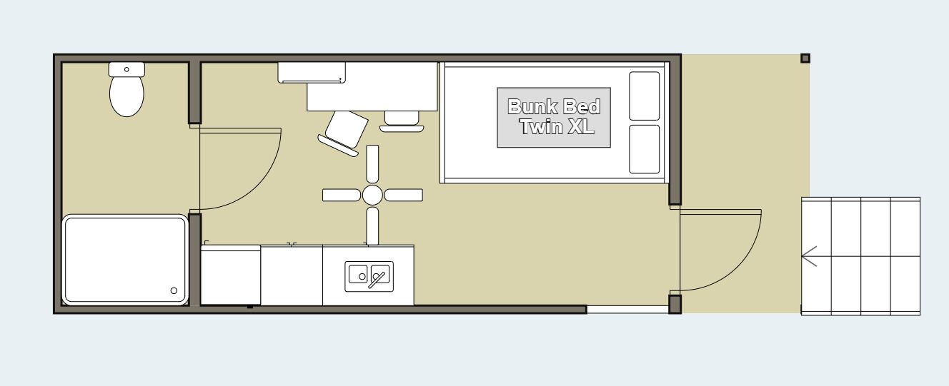 A floor plan of a hotel room with a bunk bed, a separate bathroom, a desk, and a small seating area.