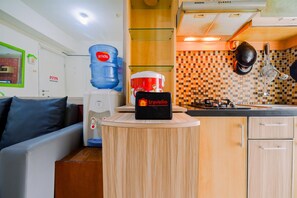 Appartamento Deluxe | Cucina privata | Frigorifero, piano cottura, risottiera