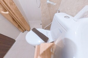 Standard Studio | Bathroom | Shower, free toiletries, towels, soap - Homey Studio At Transpark Bintaro Apartment (South Tangerang)