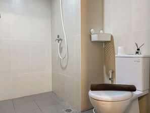 Studio | Bathroom | Shower, towels - Best Place and Homey Studio Apartment LRT City Jatibening (Bekasi)