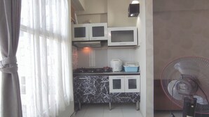 Fridge, stovetop, rice cooker, dining tables - Comfortable Living 2Br At Dian Regency Apartment (Surabaya)