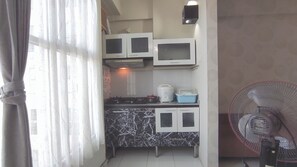 Apartment | Private kitchen | Fridge, stovetop, rice cooker, dining tables - Comfortable Living 2Br At Dian Regency Apartment (Surabaya)