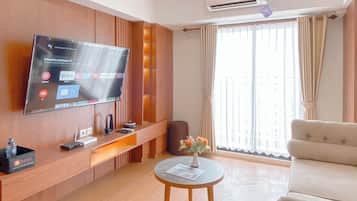 Apartamento Deluxe | Zona de estar