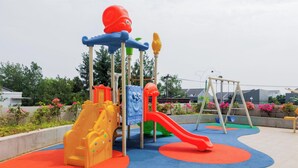 A playground with slides and climbing structures. - Best Deal And Restful Studio At Amazana Serpong Apartment (South Tangerang)