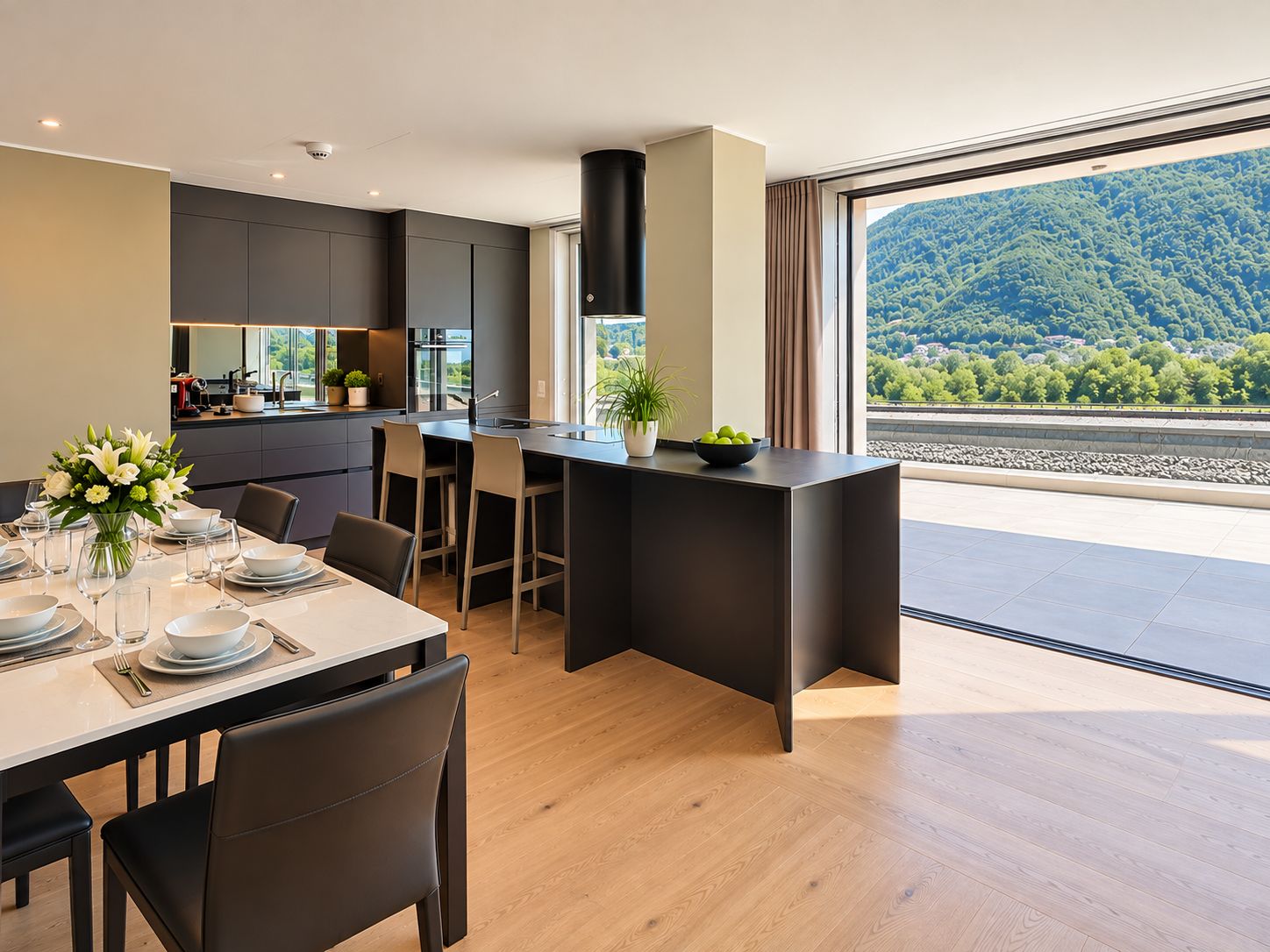 A modern kitchen with a central island, dining area with chairs, and a large window offering a scenic view.