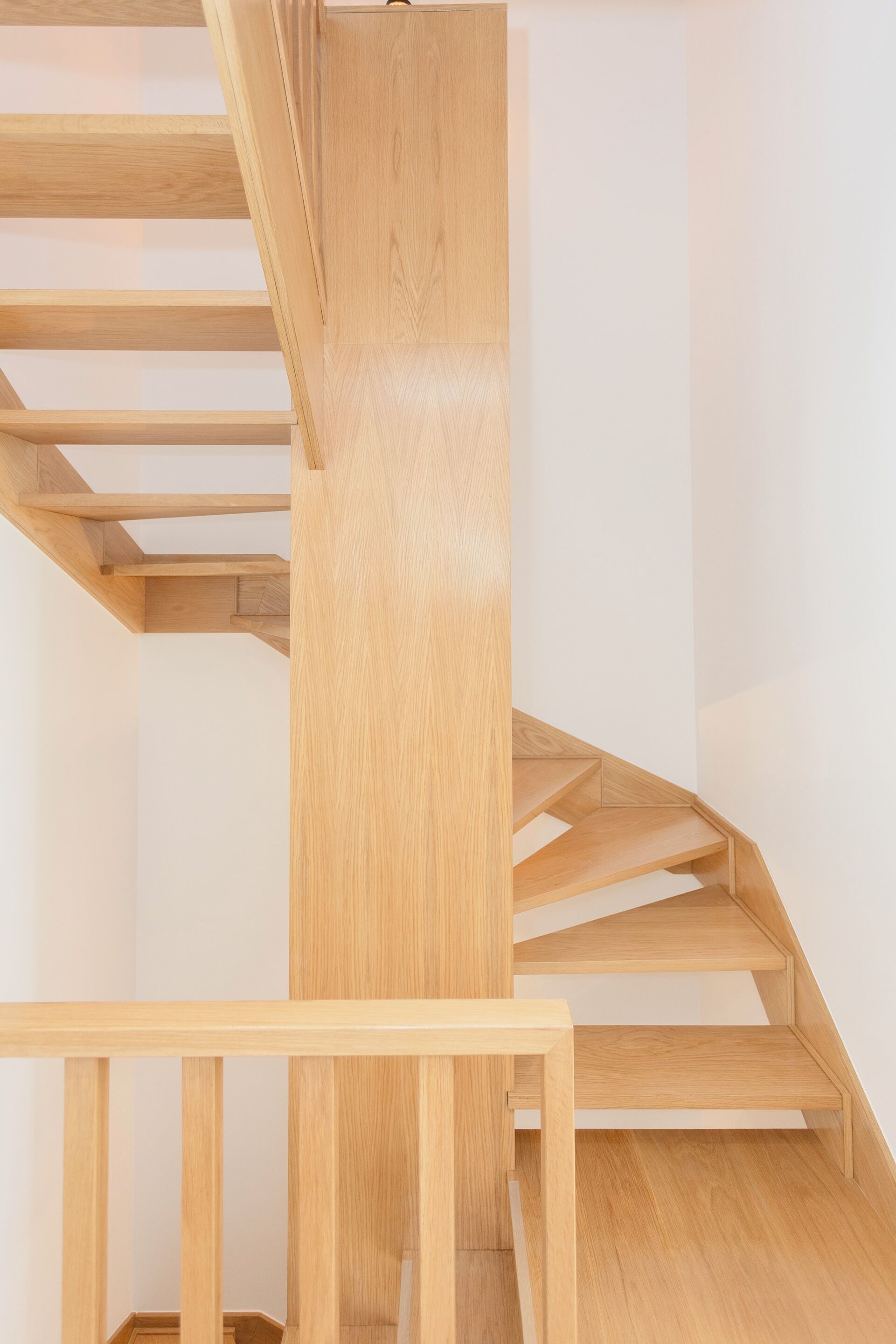 A wooden staircase with a simple design and no visible railings.