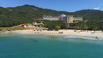On the beach, white sand, free beach cabanas, sun loungers