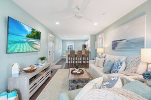 TV, books - Oceanfront 2BR Retreat | King Suite | Beachy Views (North Topsail Beach)