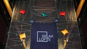 A room with a bed, a window, and a door. - Selah Lofts Pasay (Pasay)