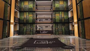 A multi-level interior with a central elevator, a patterned floor, and a sign reading 'SEAH LOFTS'. - Selah Lofts Pasay (Pasay)