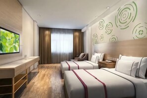 A hotel room with two beds, a desk, a TV, and a large window with curtains. - The Wall Street Holiday Hotel (Yichun)