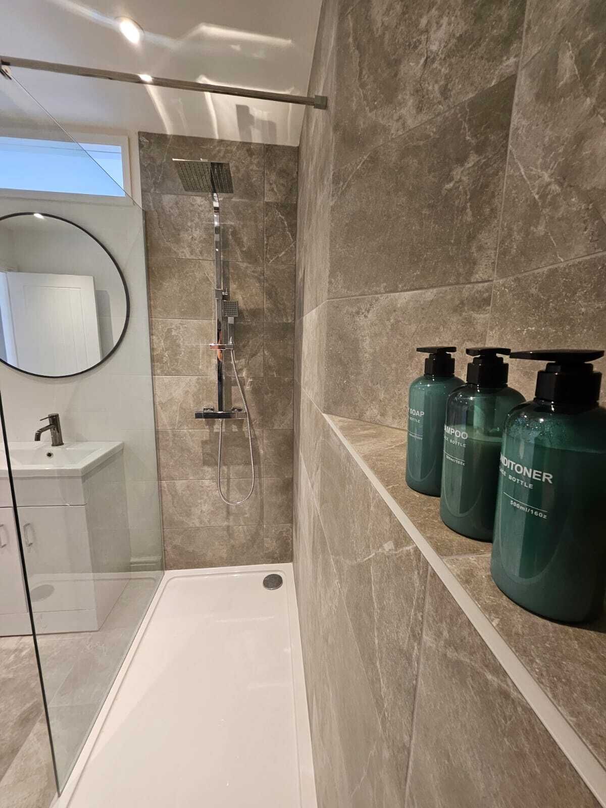 Shower, hair dryer, towels, soap