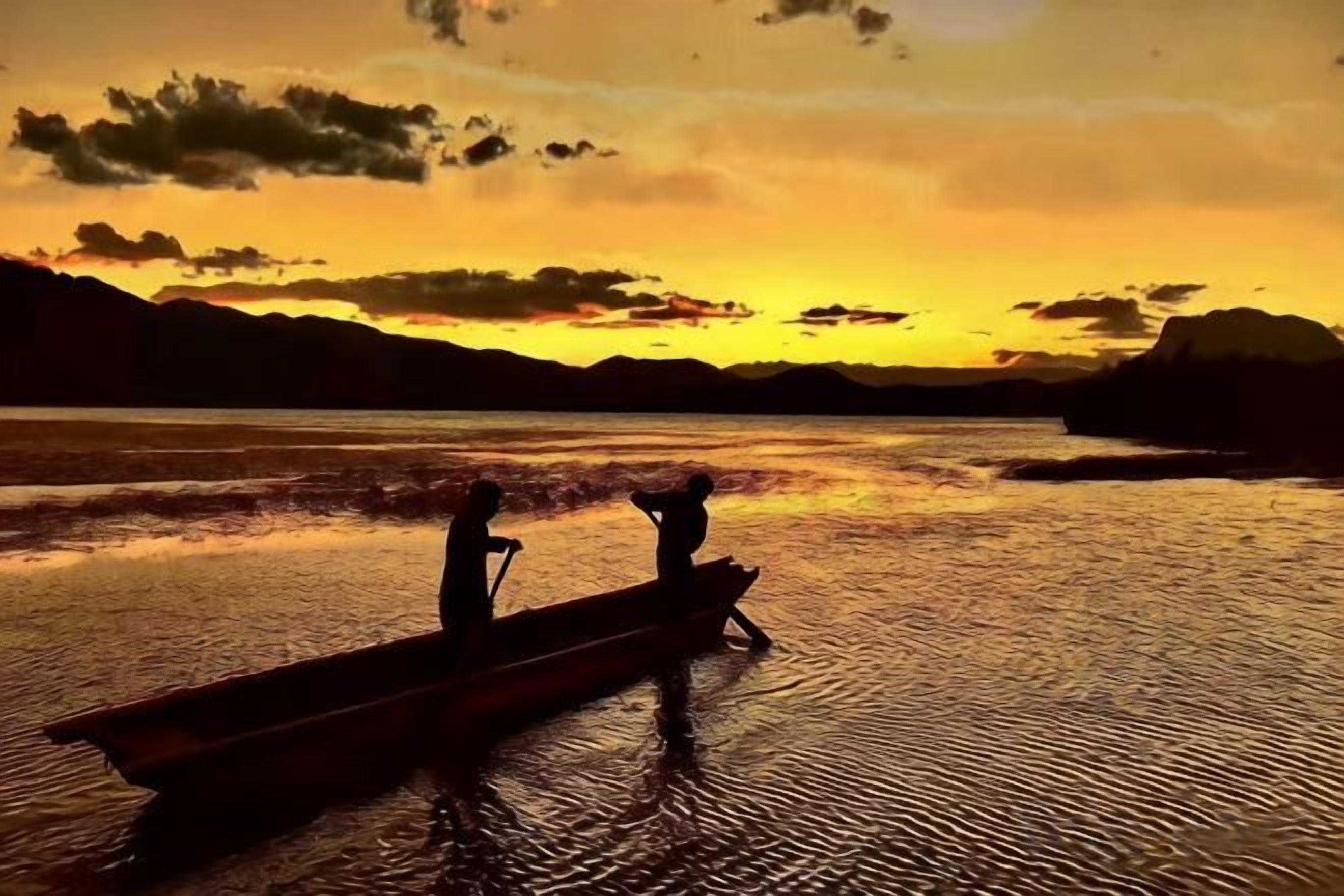 A boat with two people on a calm body of water during sunset.