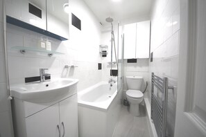 Hair dryer, towels, soap, toilet paper