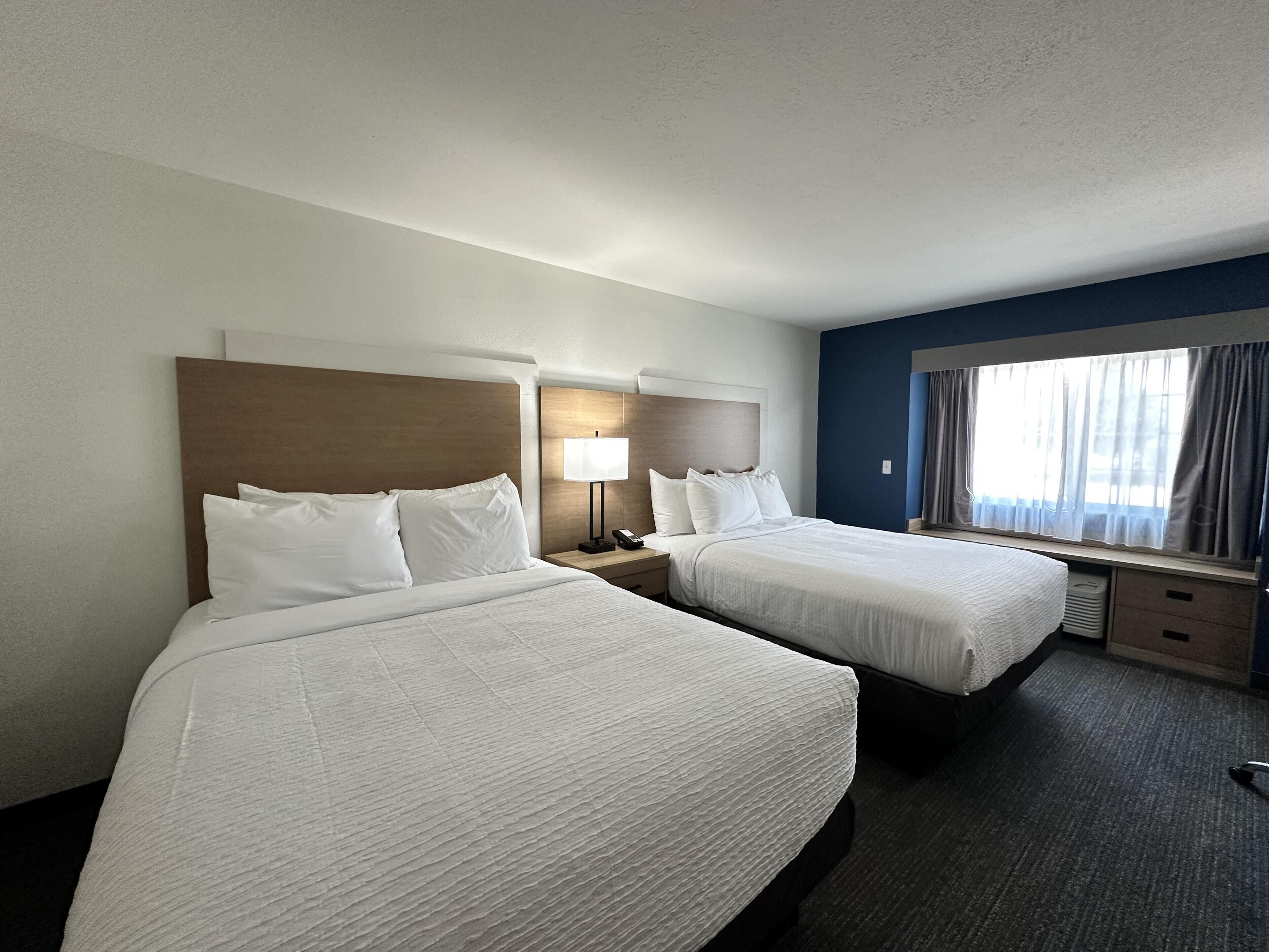 Suite, 2 Queen Beds, Non Smoking | Desk, laptop workspace, blackout drapes, iron/ironing board