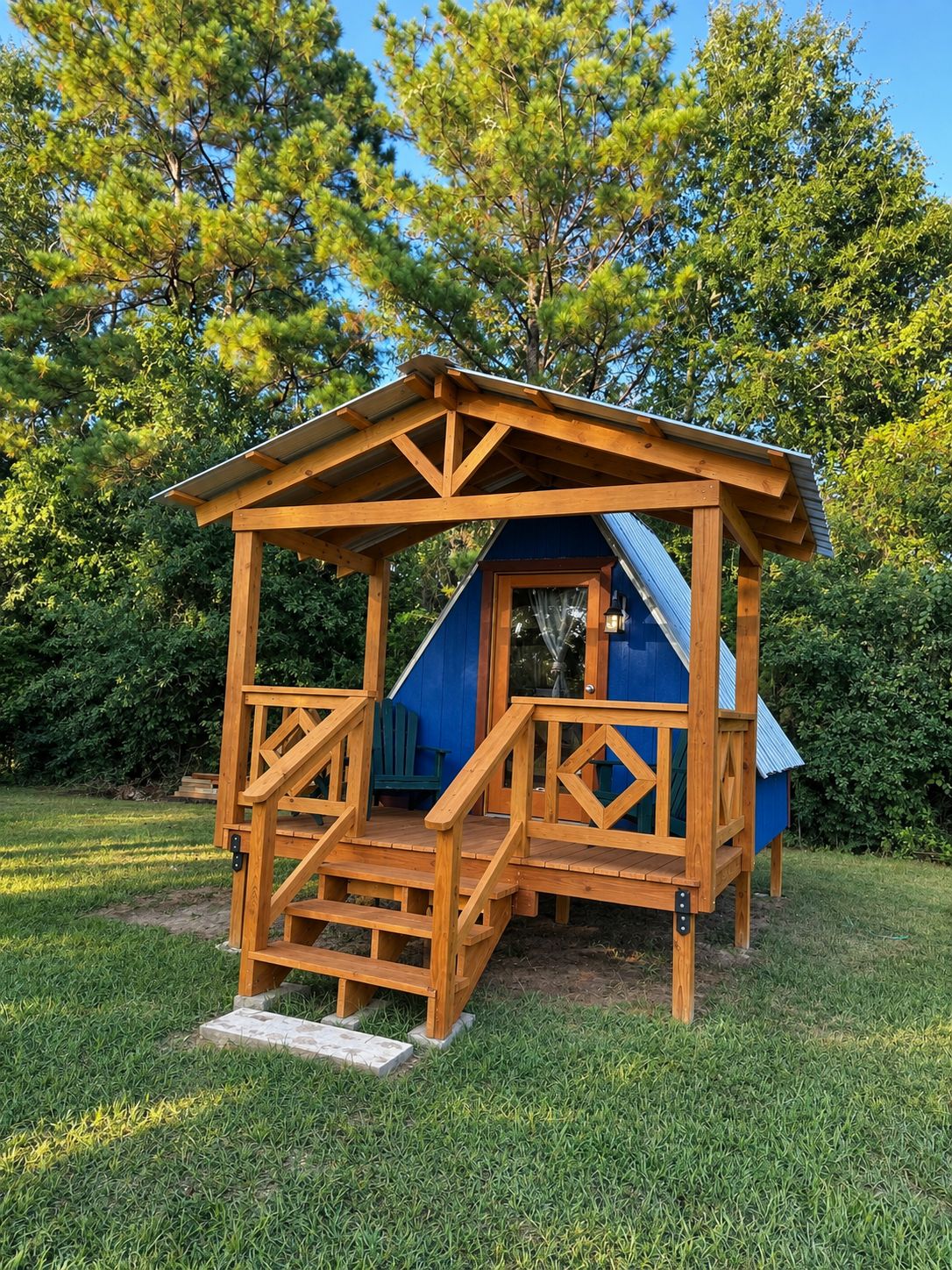 A wooden playhouse with a blue roof and a ramp leading up to the entrance.