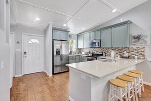 Fridge, microwave, oven, stovetop - Beachfront Home, Heated Pool on AMI by Gulfcoast Holiday Homes (Bradenton Beach)