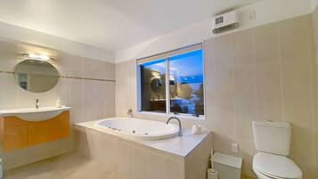 Jetted bath, hair dryer, towels, soap