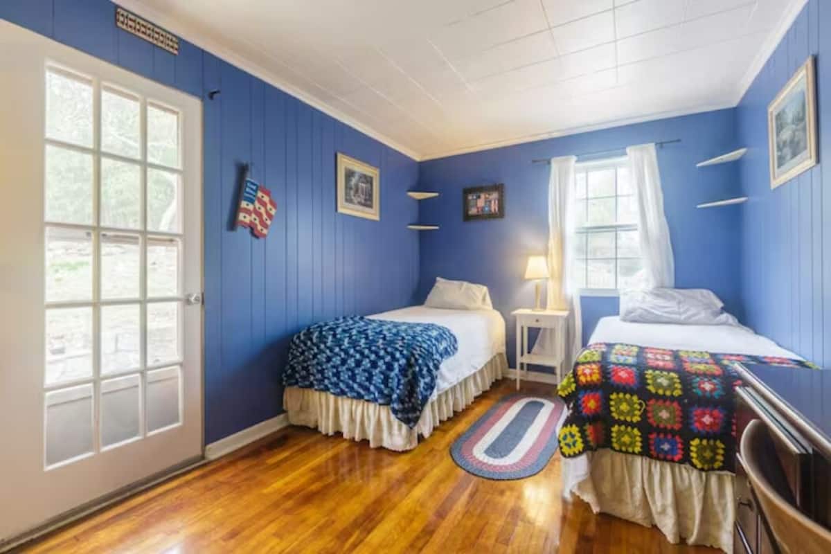 American Room At Cozy Homeva | Desk, laptop workspace, blackout drapes, iron/ironing board