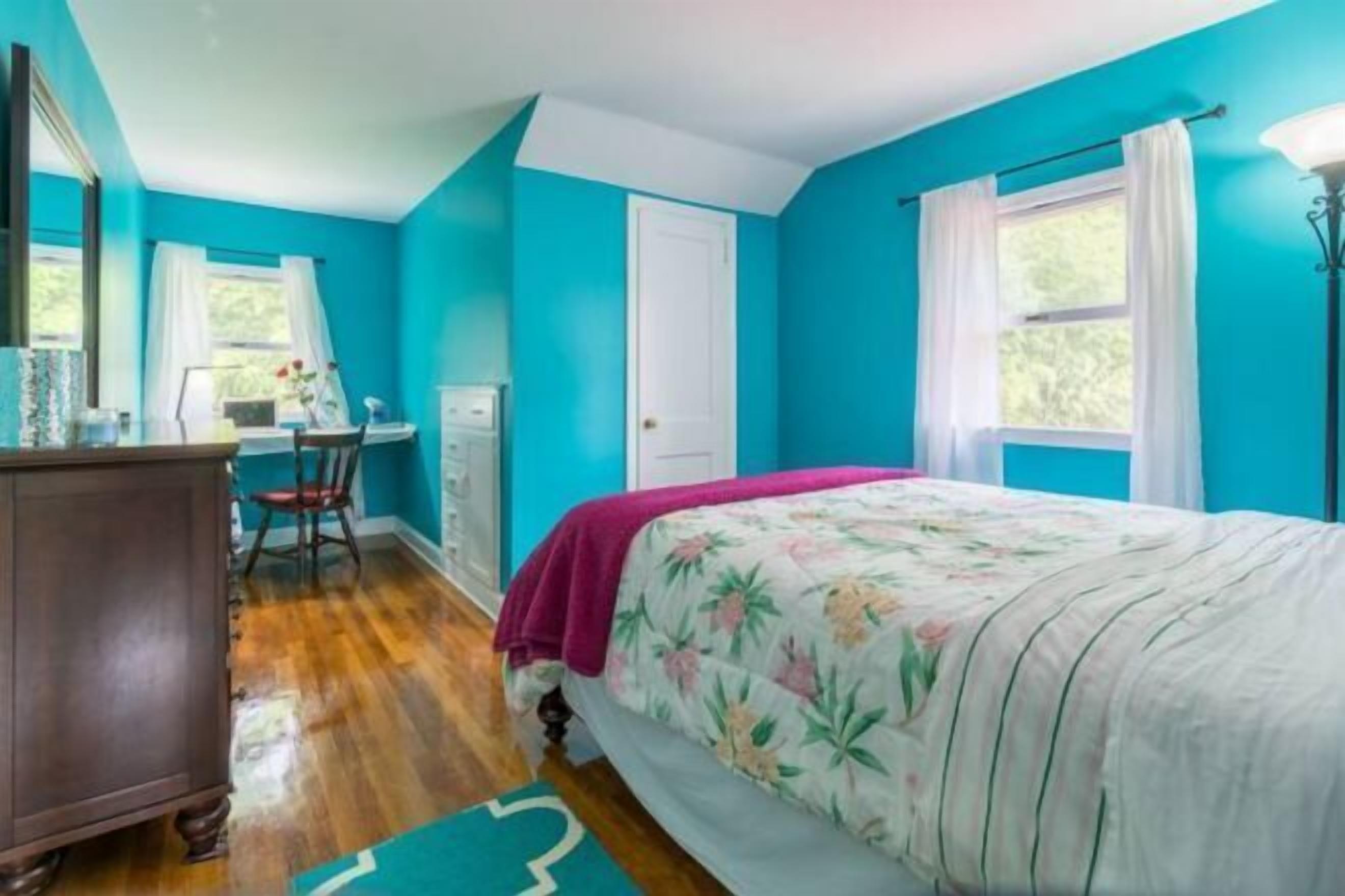 Desk, laptop workspace, blackout drapes, iron/ironing board