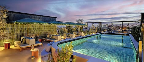 Outdoor pool, open 8:00 AM to 5:00 PM, pool umbrellas, pool loungers