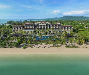 A resort with multiple buildings, a central pool, and a beach area. - The Sira, A Luxury Collection Resort And Spa, Lombok (Tanjung)
