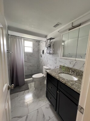 Shower, hair dryer, towels, soap