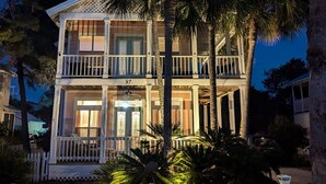 A two-story building with a balcony, a porch, and a number '97' displayed. - A Dose of Destin (Destin)