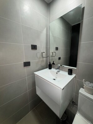 Hair dryer, towels, soap, toilet paper